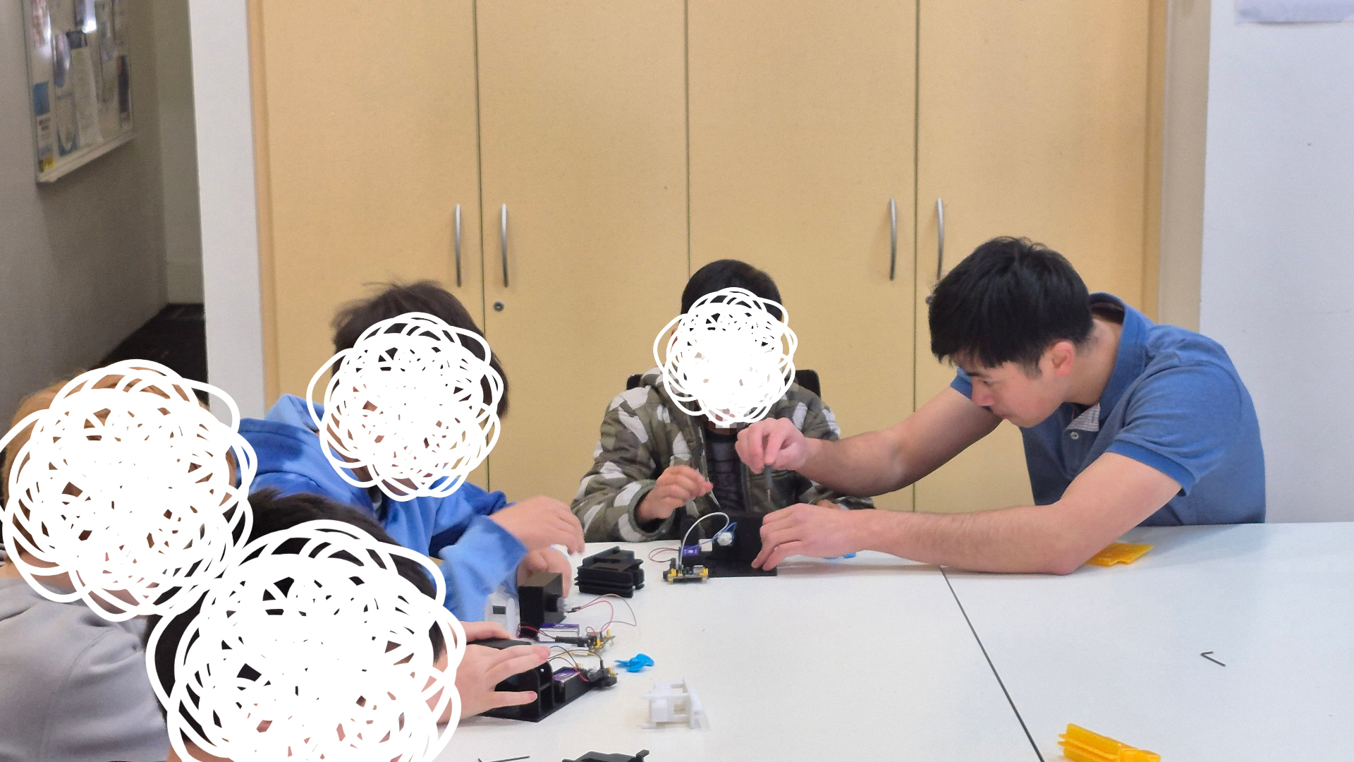 Students building electronics projects at EBK Academy